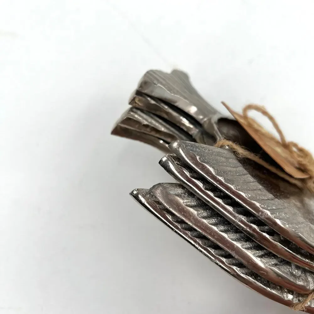 Tommy Bahama silver metal fish-shaped coaster or candle holder set.
